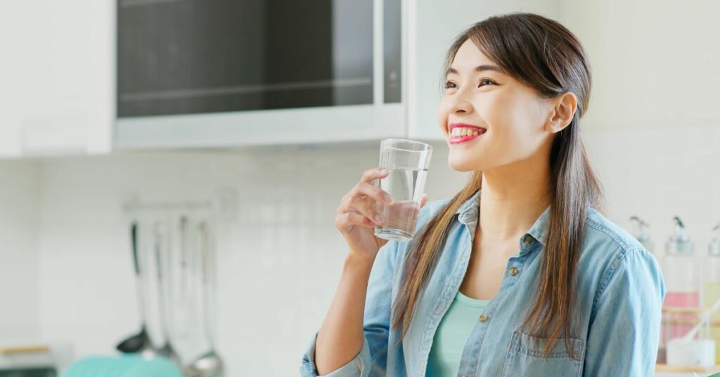Happy Woman Drinking Water
